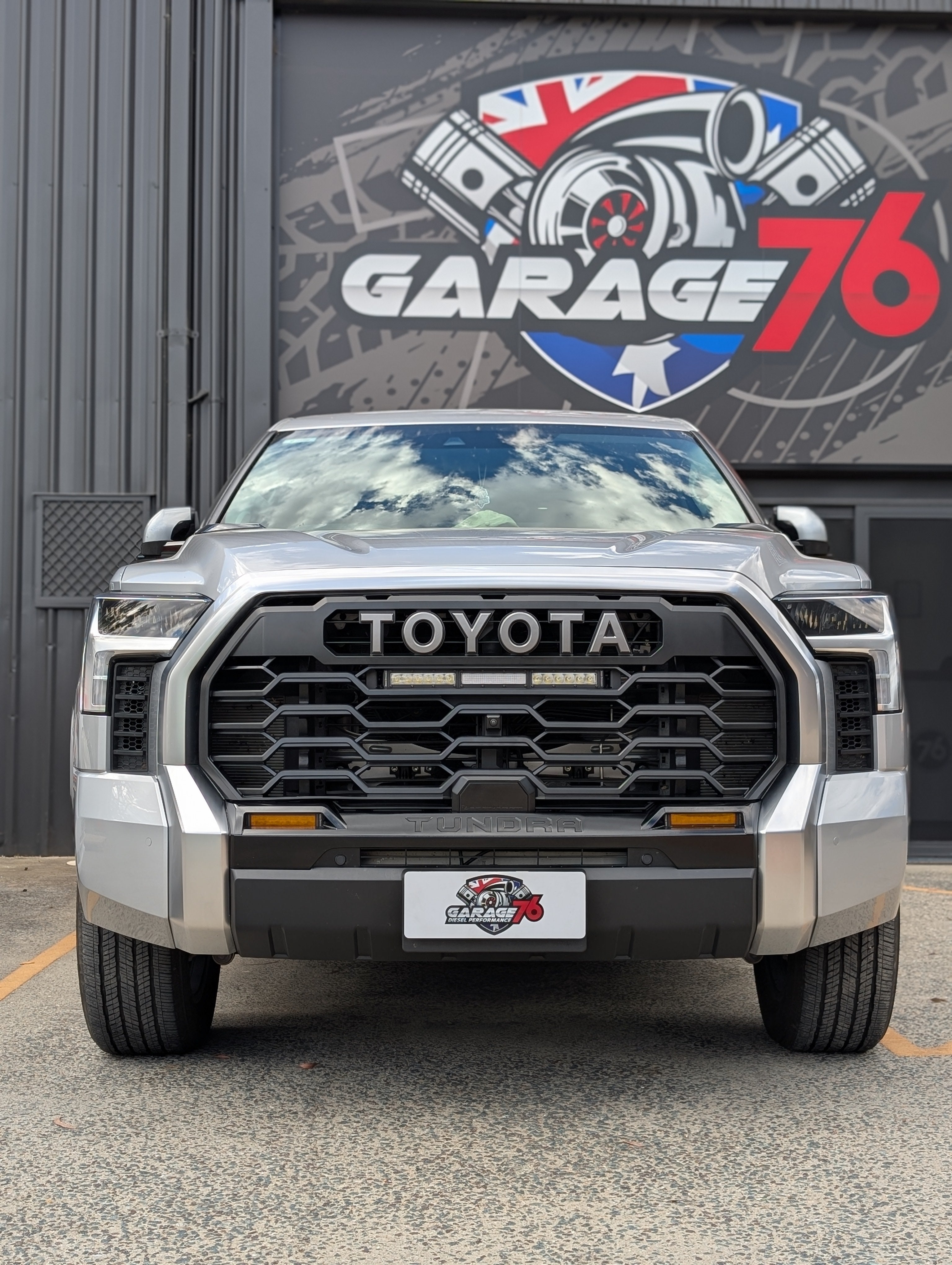 Toyota Tundra in front of a Garage 76 sign